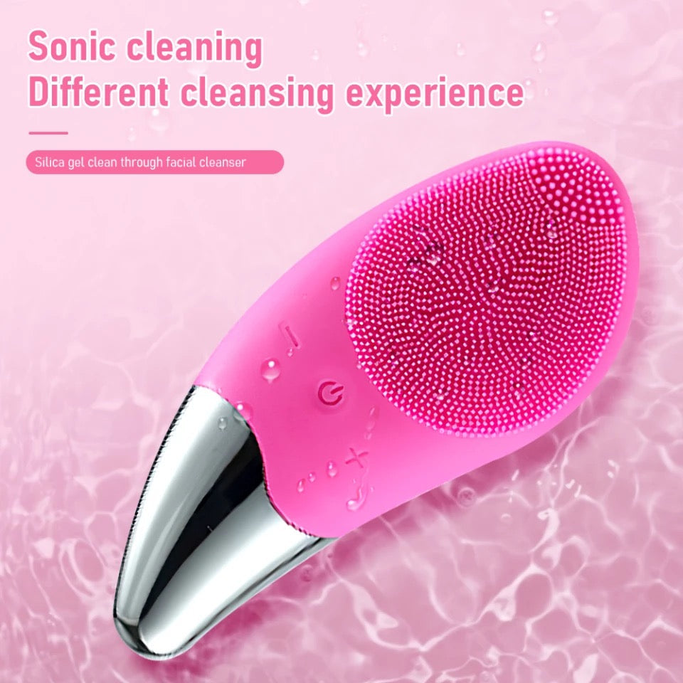 Vibrant Pink Sonic Facial Cleansing Brush Sits in Water, Sonic Cleaning is a Different Cleansing Experience